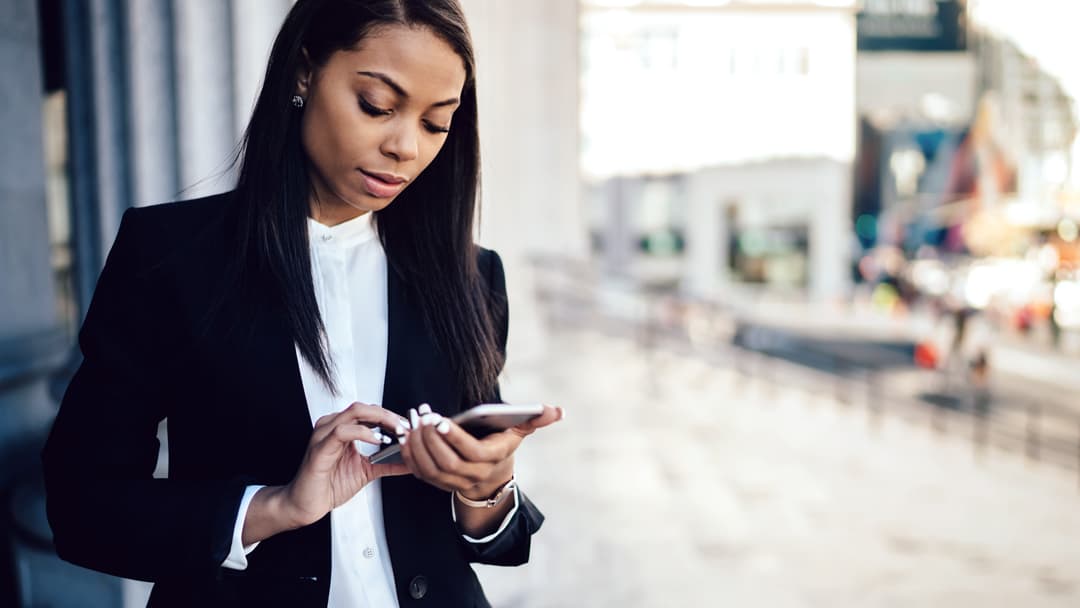 information worker checking phone